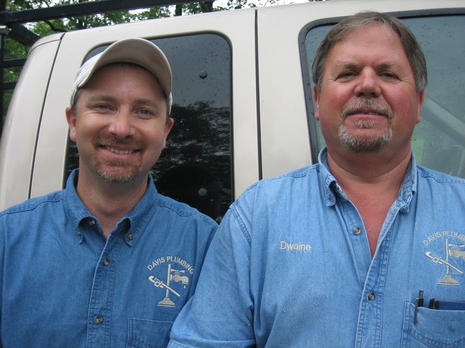 Dwaine and a colleague from Davis and Tice Plumbing in branded work shirts